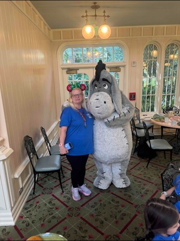 Meeting Eeyore the donkey character at Disney World
