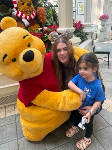 Family meeting Winnie the Pooh at Disney World during the holidays