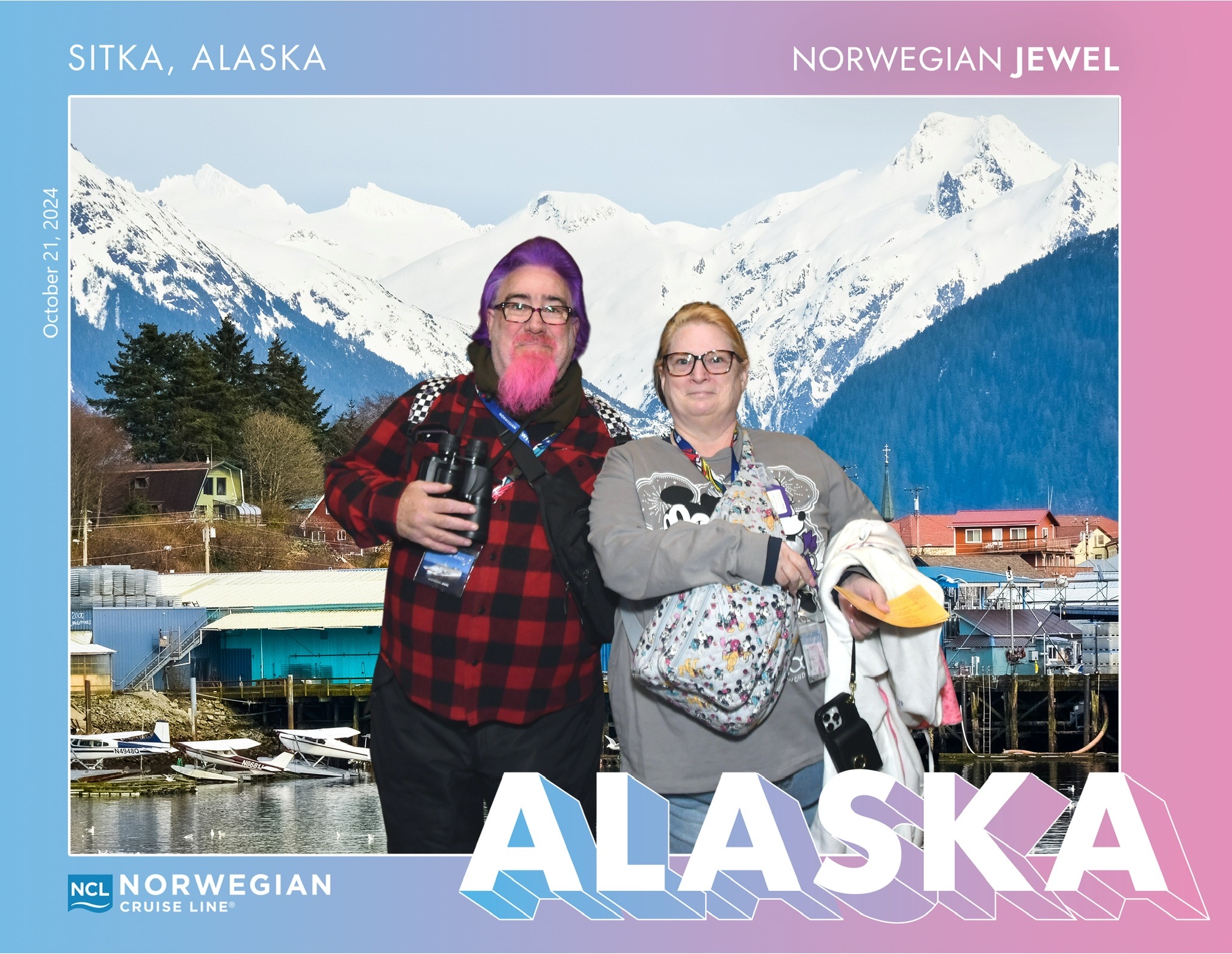 Norwegian Cruise Line souvenir photo of Lawrence and his wife posing in front of a Sitka waterfront and snow-capped mountains backdrop