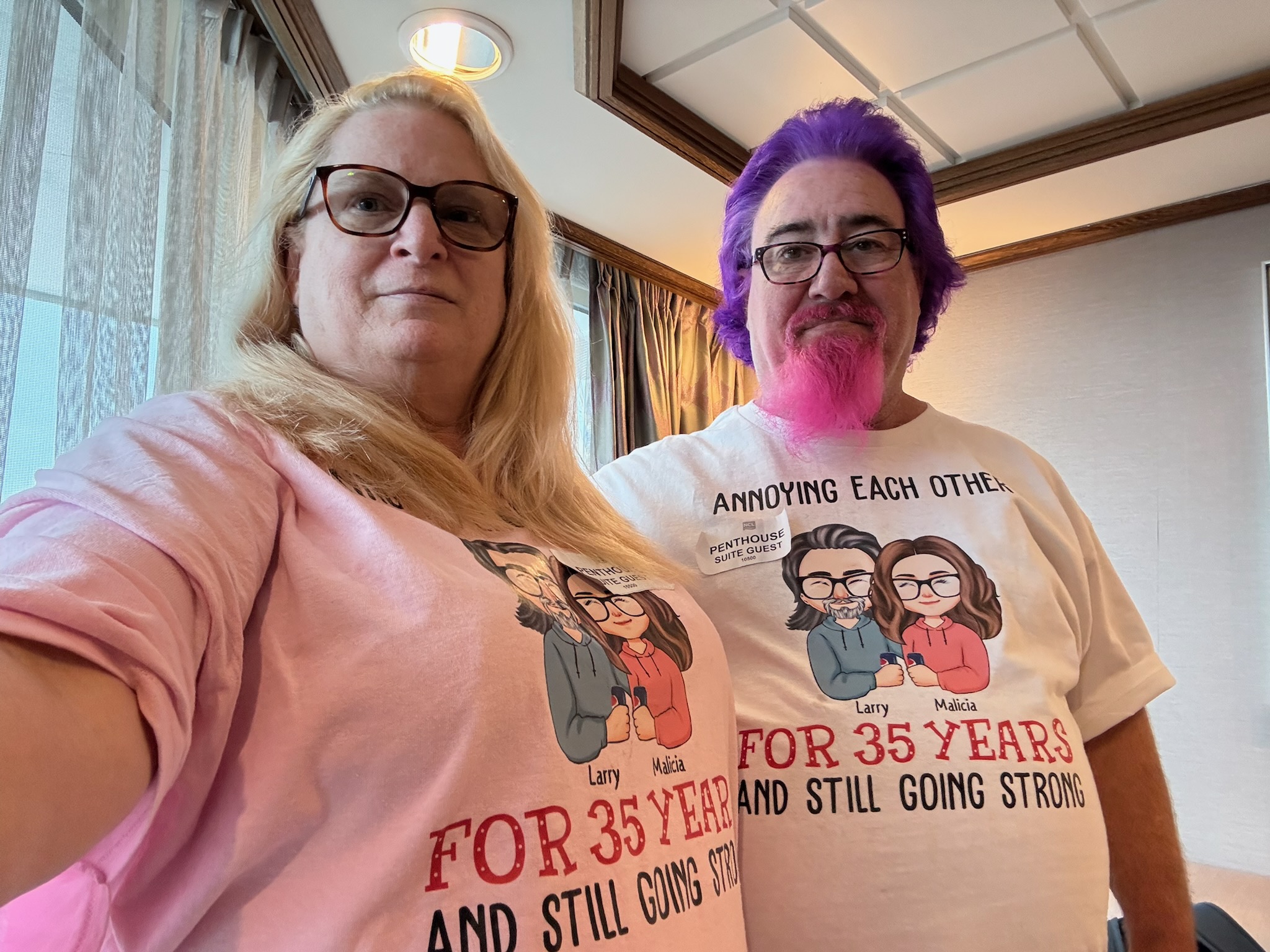 Lawrence and his wife wearing matching custom t-shirts reading Larry and Malicia — Annoying Each Other For 35 Years And Still Going Strong